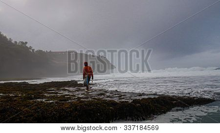 A Stretch Of White Sand On The Coast Of Widodaren Yogyakarta Indonesia. Lots Of Beautiful Rocks And 