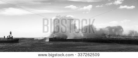 Waves Crashing Over Lighthouse In Kalk Bay Harbour As Fishermen Brave Storm, Cape Town, South Africa