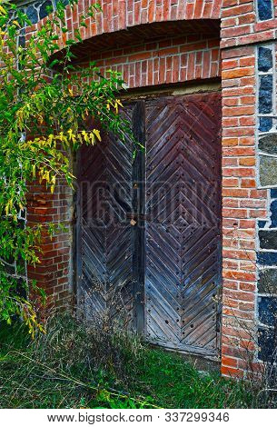 Wooden Door To An Abandoned Old Water Mill Building On The Southern Bug River, Vinnytsia Region, Ukr