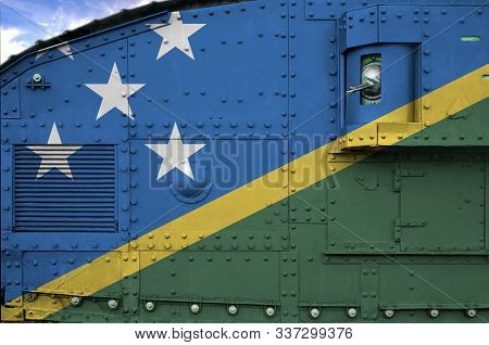 Solomon Islands Flag Depicted On Side Part Of Military Armored Tank Closeup. Army Forces Conceptual 