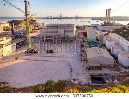 Delimar Power Station And A Large Gas Carrier At Sunset. Marsashlok. Malta.