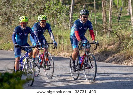 Villa De Leyva, Boyaca, Colombia - December 1, 2019:  Men And Women Of All Ages Ride Bicycles During