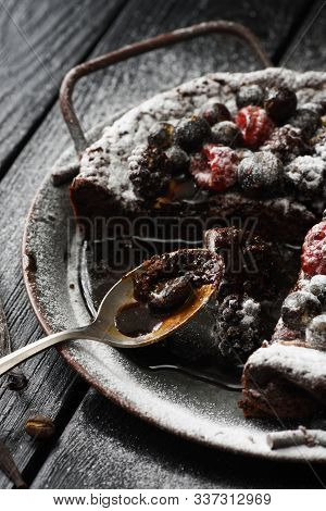 Traditional Scandinavian Chocolate Dessert Kladdkaka. Gluten Free Cake With Raw Berries And Licorice