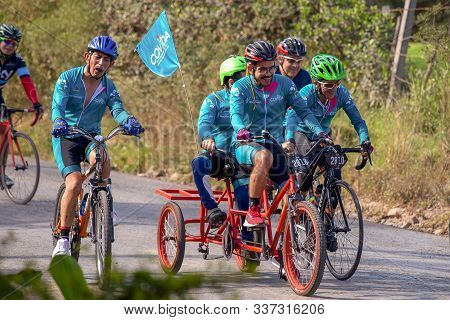 Villa De Leyva, Boyaca, Colombia - December 1, 2019:  Men And Women Of All Ages Ride Bicycles During