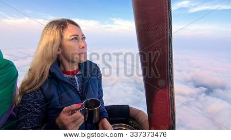 Woman Eat Sandwich And Drinks Tea And Coffee In Flight. Adventure On Hot Air Balloon. Fly In Morning