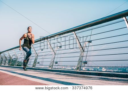 Determination Of Young Professional Runner Stock Photo