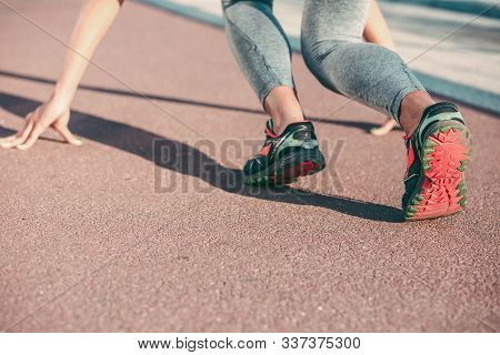 Sportswoman At The Crouch Start Stock Photo