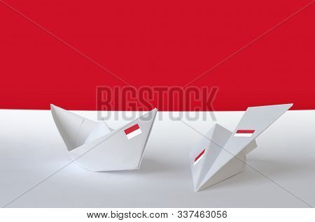 Indonesia Flag Depicted On Paper Origami Airplane And Boat. Handmade Arts Concept