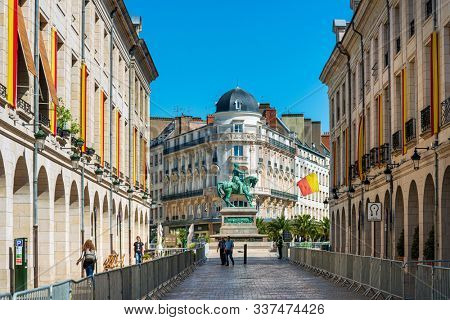 ORLEANS, FRANCE - May 8, 2018: statue Joan of Arc is an 1874 French gilded bronze equestrian sculpture of Orleans Cathedral in Orleans, France