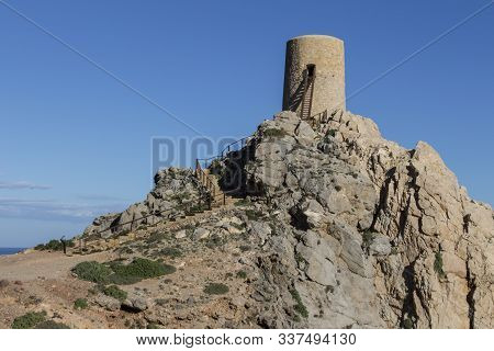 View Of A Tower From Mojacar, View Of Pirulico Tower On Rocky Mountain In Mojacar Beach, Distric Alm