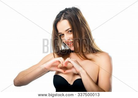 Beautiful Woman Making A Heart Shape Jesture With Hands, Isolated On White Background. Emotions Conc
