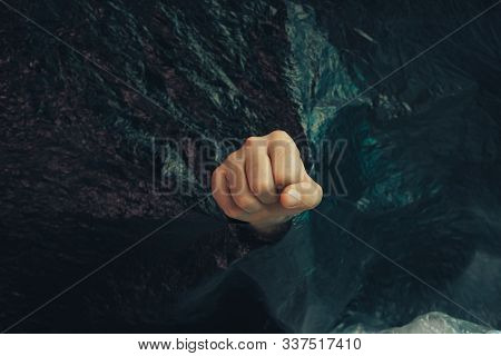 Beautiful Abstract Plastic Cellophane  Bag Background. Human Hand Fist Palm Stop. No Plastic Bag Con