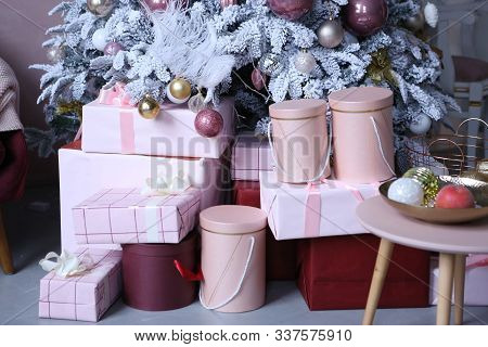 Christmas Presents In Boxes With Decoration Close Up Photo In Room Interior