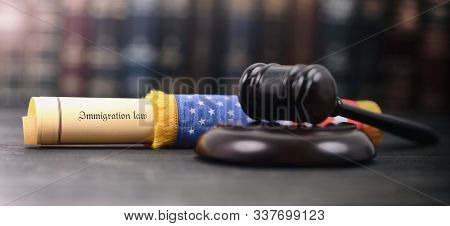 Immigration Law Wrapped In A Usa Flag, Imigration Regulation Concept, Judge Gavel On The Wooden Back