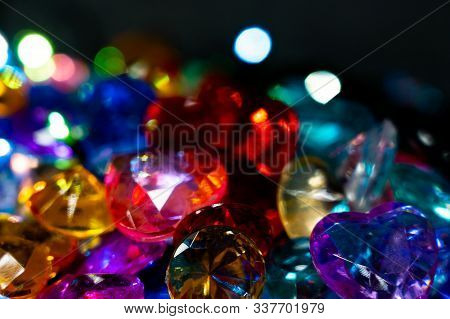 Multi-colored Glass Pebbles Glow In The Dark With Bright Saturated Colors. Close-up. Multi-colored F
