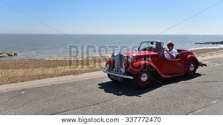 Felixstowe, Suffolk, England -  May 06, 2018: Classic Red Singer Convertible Motor Car Being Driven 