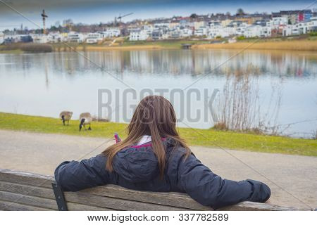 Woman Stands On A Beanch And Looks At Beauty Of Amazing Pictorial Landscape Of European Style City W