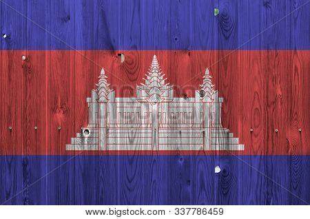 Cambodia Flag Depicted In Bright Paint Colors On Old Wooden Wall. Textured Banner On Rough Backgroun