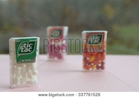 Many Tic Tac Candy Packages On Green Wood Background. Tic Tac Is Popular Due Its Minty Fresh Taste A