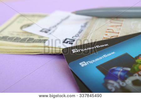 Privatbank Check Lies With Credit Cards And Pen On Dollar Bills With Passport. Privatbank Is A Main 