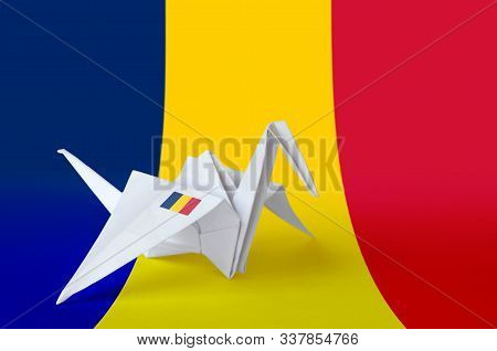 Chad Flag Depicted On Paper Origami Crane Wing. Handmade Arts Concept