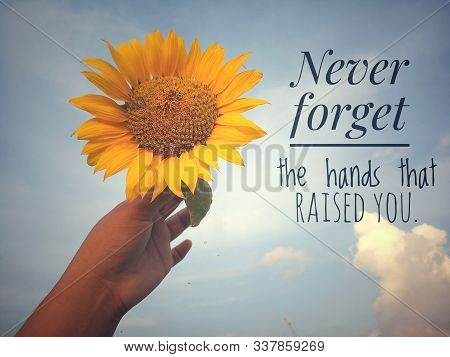 Inspirational Motivational Quote - Never Forget The Hands That Raised You. With Background Of Blue S