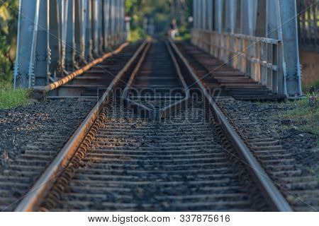 Sunshine over Bentota river, Olg Bridge, Galle district, Sri Lanka on a perfectly still day under a