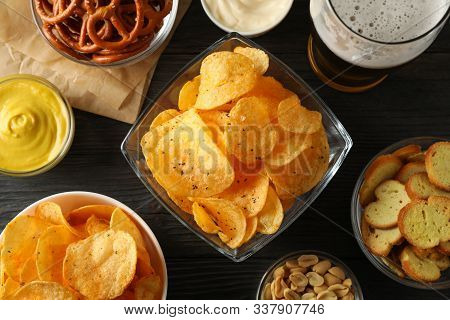 Beer Snacks, Glass Of Beer, Potato Chips, Beer Nuts, Sauces, Glass Of Beer On Wooden Background, Clo