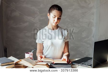 Girl Is Preparing For The Exam Reading Book Works At The Computer