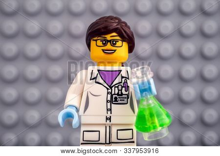 Tambov, Russian Federation - October 19, 2019 Lego Scientist Minifigure With Green Flask Against Gra