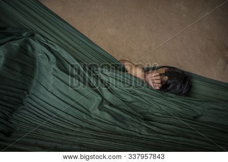 Siemp Reap, Cambodia - January 19, 2011: Young Little Girl From Siem Reap In An Outskirt Slum Sleeps