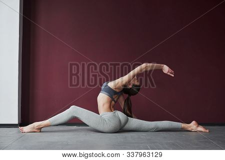 For The Spine. Girl With Good Fitness Body Type Have Exercises In The Spacey Room.