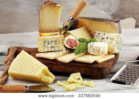 Different Sorts Of Cheese. Cheese Platter With Different Cheese And Spice