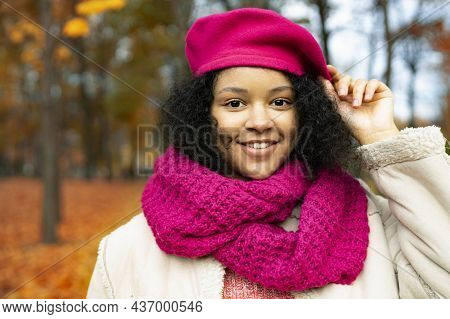 Portrait Of A Happy Young. Dark-skinned Black Woman, In An Autumn Park. Close-up, Smiling And Laughi