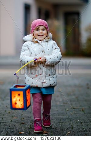 Little Kid Girl Holding Selfmade Lanterns With Candle For St. Martin Procession. Healthy Cute Toddle