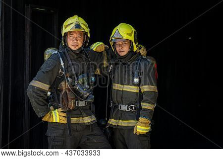 Fireman Wearing Firefighter Turnouts Holding Helmet Ready For Emergency Service,fireman In Emergency