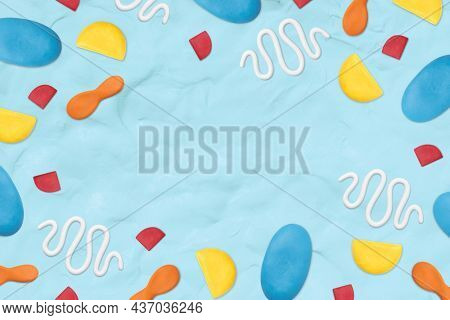 Kids clay patterned frame on blue textured background creative craft for kids