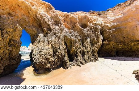 Aerial and panoramic view of Praia dos Tres Irmaos beach, Alvor, Algarve, Portugal