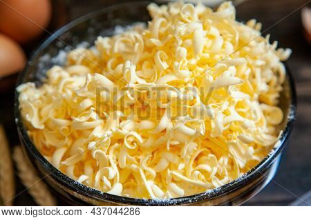 Grated Butter For Baking On Table. Baking Ingredients For Shortbread Pastry: Grated Butter, Flour, E