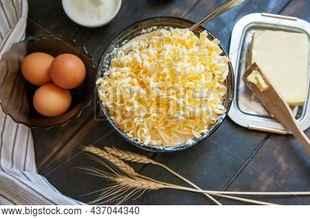 Grated Butter For Baking. Baking Ingredients For Shortbread Pastry: Butter, Eggs, Sour Cream On A Wo