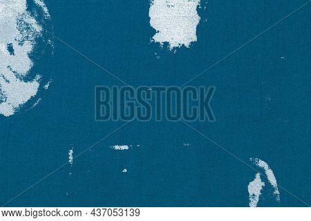 Blue textured background with white fabric stain