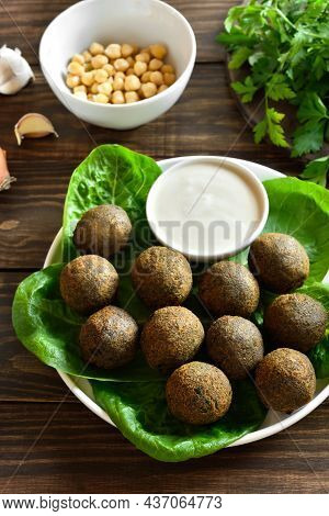 Falafel Balls. Deep Fried Balls From Ground Chickpeas. Traditional Middle Eastern Food. Wooden Backg