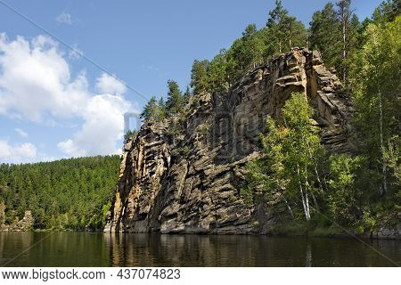 Russia. Chita Region. Coastal Rocks On The Burkal River, Whose Fast Waters Tend To The Selenga River