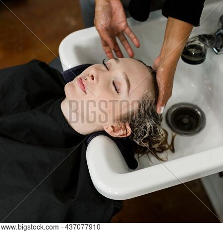 Woman getting a hair wash at a beauty salon