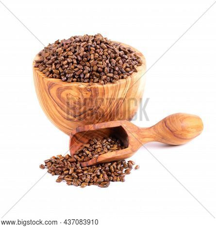 Cassia Tora Beans In Olive Bowl And Scoop, Isolated On White Background. Sicklepod Or Senna Obtusifo