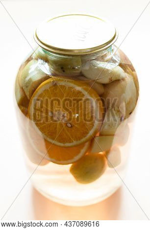 3-liter Glass Jar With Homemade Kompot (stewed Fruit) Made From Sliced Fresh Apples And Oranges Clos