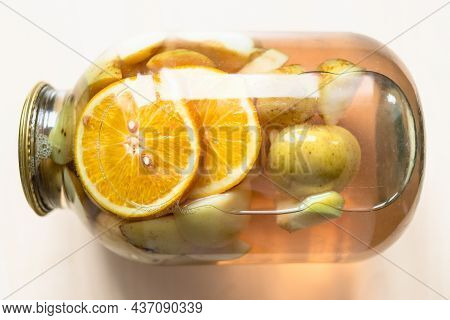 Above View Of Lying 3 Liter Glass Jar Of Homemade Kompot Made From Sliced Fresh Apples And Oranges O