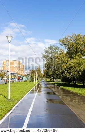 Wet Sidewalk With Bike Path Along Bolshaya Akademicheskaya Street In Koptevo District Of Moscow City