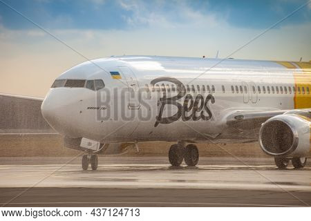 Bees Airline Yellow Plane On The Apron. Boeing 737-800 Ur-uba Passenger Aircraft. Ukraine, Kyiv - Ma