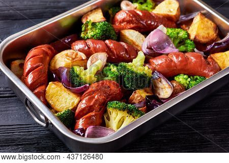 Sausage And Vegetable Traybake With Smoked Pork Sausage, Broccoli, Potato, Red Onion, Garlic On A Ba